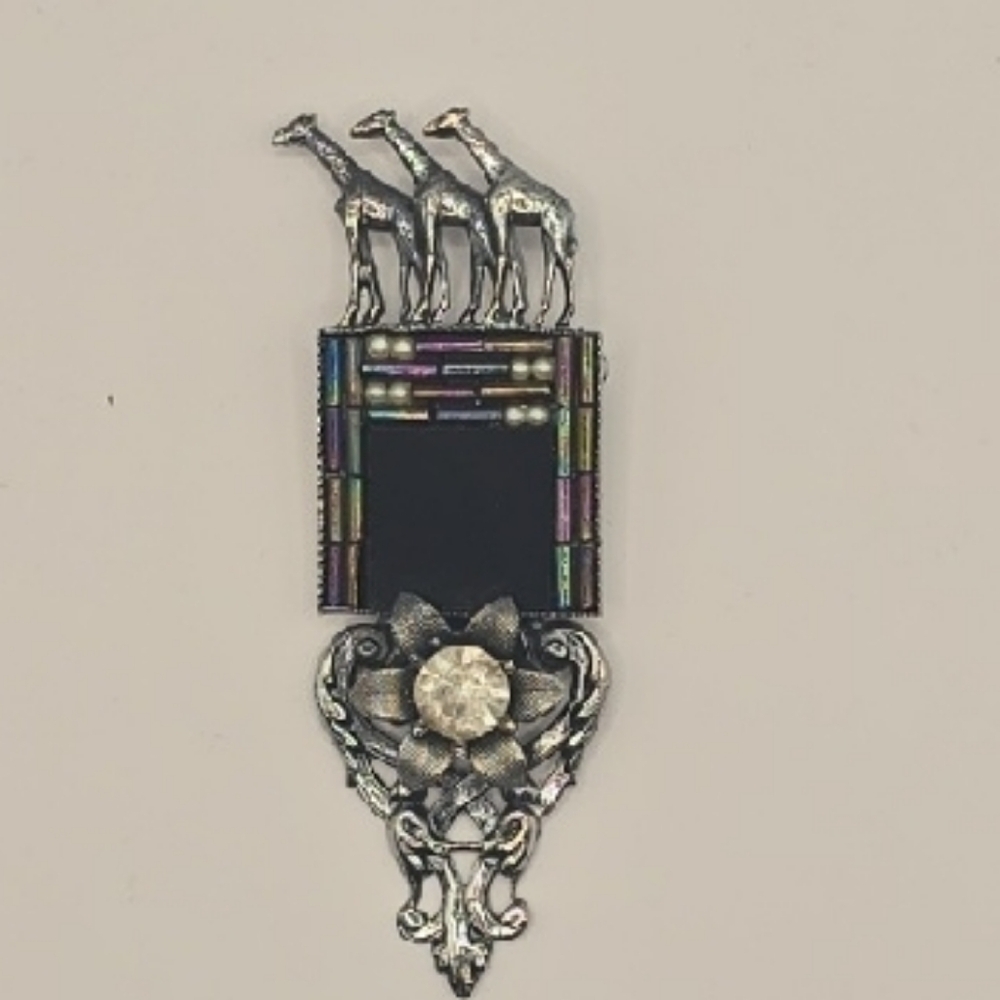 Silver and Black Brooch with Giraffe Design